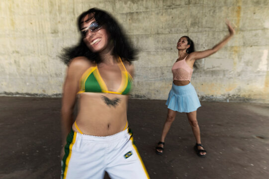 Blurry action of dancers, direct flash
