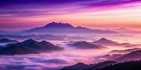 Fototapeta premium Landscape of purple light over mountains at sunrise with misty haze