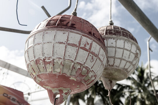 Sun faded colorful buoys for a boat hanging off a pier at tropical island Bora Bora in French Polynesia