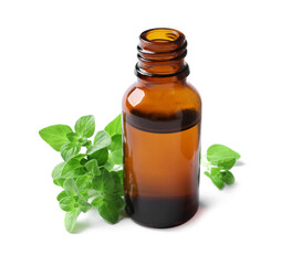 Essential oil in bottle and oregano leaves isolated on white