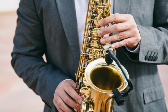 Man Playing Saxophone Outdoors