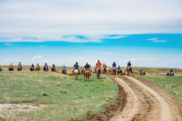 Group of horse riders on cattle drive