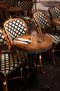 Chair and table setting at a bistro in Paris, France