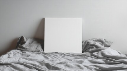 Blank Canvas Inspiration: Clean A4 paper positioned vertically on white bed as creative background for art or ideas.