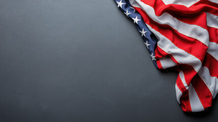 Close-up of the American flag draped over a dark, textured background, symbolizing patriotism, freedom, and national pride.