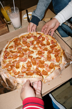 Family sharing a pizza