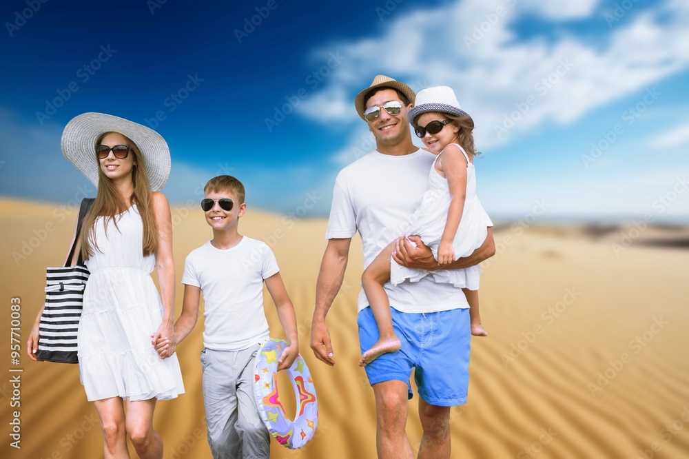 Poster Happy young family and children on the beach on vacation