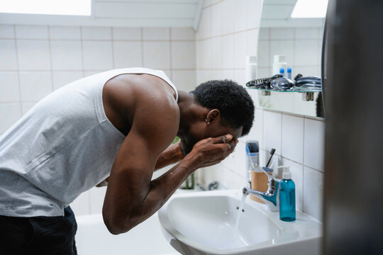 A man washes his face