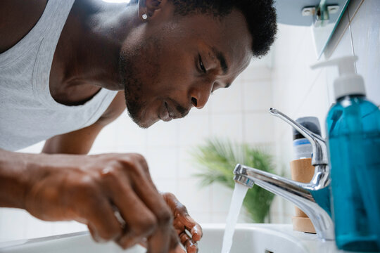 A man washes his face