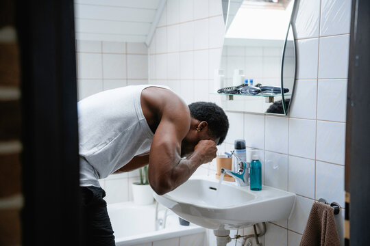 A man washes his face