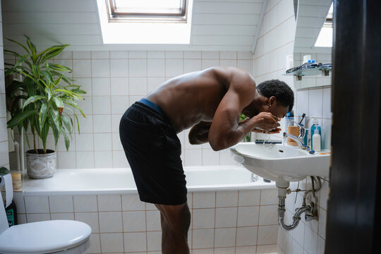 A man washes his face