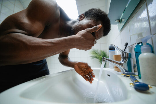 A man washes his face