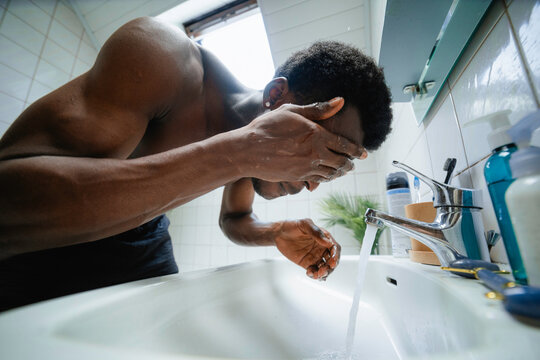 A man washes his face