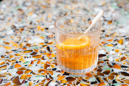 Orange Cocktail on Mosaic Table
