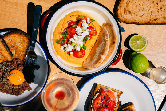 Gourmet Beef Tartar and Hummus Topped with Tomatoes