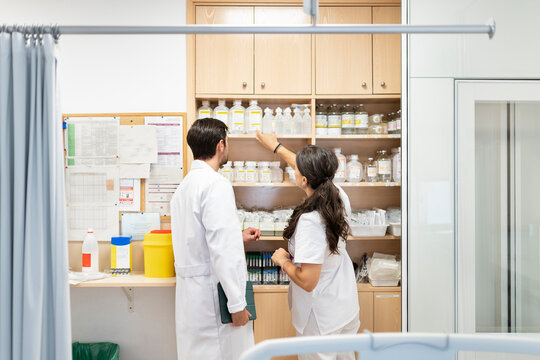Medical staff collaborating on supply management in hospital