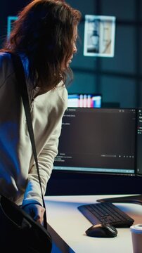 Vertical video Computer scientist arriving in home office, ready to design and develop software applications. IT expert starting job shift, implementing and maintaining company systems, camera B