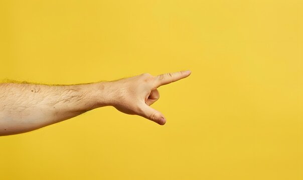 Arm and hand of caucasian man over yellow isolated background snapping fingers for success, easy and click symbol gesture with hand.