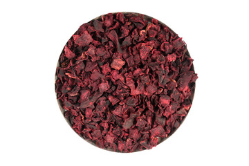 Dry beetroot pile isolated. Dried diced red beet cubes, scattered small beet root pieces, dry beetroot flakes on white background top view. Beetroot chips.