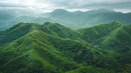 Obraz premium Verdant mountain range - Rolling hills creating abstract nature background for adventure
