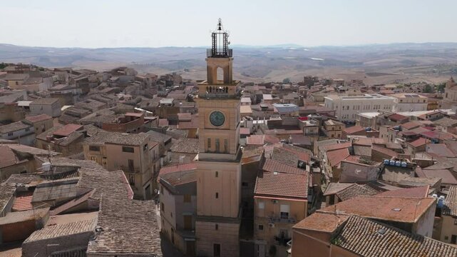 alt flying counter clockwise around clock tower in Sommatino Sicily