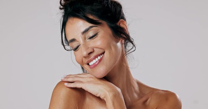 Happy, woman and proud with skincare in studio for natural treatment, facial wellness or dermatology glow. Female person, smile and cosmetics shine, salon results or beauty change on white background