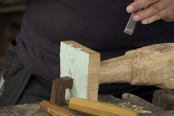 The craftsman is carving
