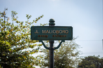 Road sign with text : JL.Malioboro in Malioboro street in Yogyakarta Indonesia. road signs that has become an icon of Yogyakarta.
