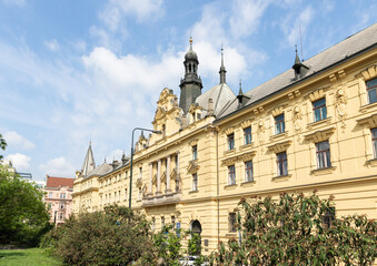 Old building decorated with statues and bas reliefs on the Charles Square in old part of Prague in Czech Republic