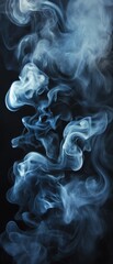 Fototapeta premium Elegant blue smoke swirling gracefully against a black background, creating mesmerizing patterns and textures.