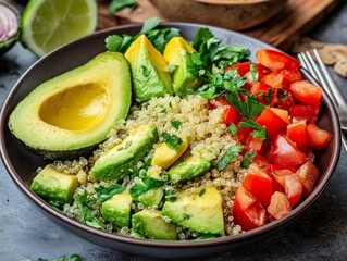 Fresh quinoa bowl with avocado, tomatoes, and herbs, perfect for a healthy meal or light lunch. Vibrant and nutritious.