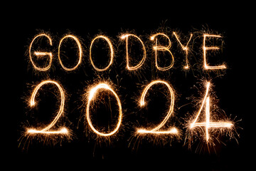 Happy New Year 2025. Burning sparkling text 2025 isolated on black background.