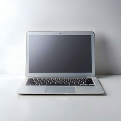 A clean and modern laptop with a black screen sits open on a white surface. ready for your content or message.