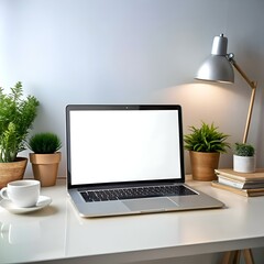 Fototapeta premium Clean and modern mockup of a laptop on a desk with plants and a lamp.