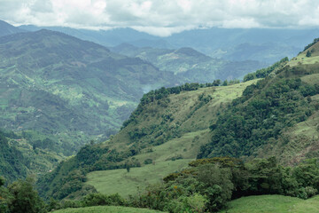 Fototapeta premium Beautiful landscape in the Andes Mountains. Clouds. Jardin, Jardín, Antioquia, Colombia.