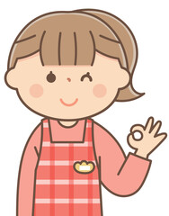 Fototapeta premium オッケーサインをする保育士の女性
