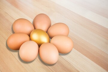 Stack of fresh tasty chicken egg on desk