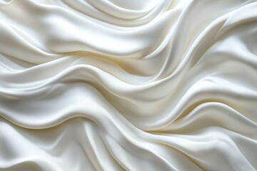 Fototapeta premium A close-up view of luxurious white silk fabric, showcasing its smooth texture and flowing drapes against a soft background