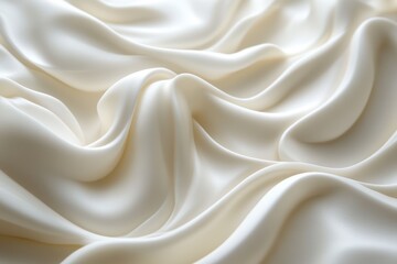 Obraz premium A close-up view of luxurious, soft ivory silk fabric gently draped, showcasing its smooth texture and elegant folds