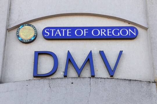 Beaverton, Oregon, USA - March 7, 2024 -  Department of motor vehicles (DMV) big blue sign on its building in the State of Oregon