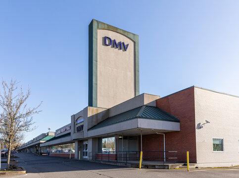 Beaverton, Oregon, USA - March 7, 2024 -  Department of motor vehicles (DMV) big blue sign on its building in the State of Oregon