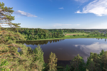 A lake with a forest in the background