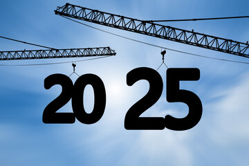 Happy new year Silhouette of 2025 lifting crane on blue sky background.