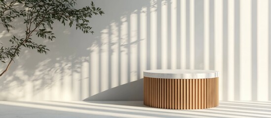 Fototapeta premium Minimalist luxury cylindrical podium featuring wooden slats and a white marble top against a white wall complemented by a tree shadow background for product display 3D render illustration