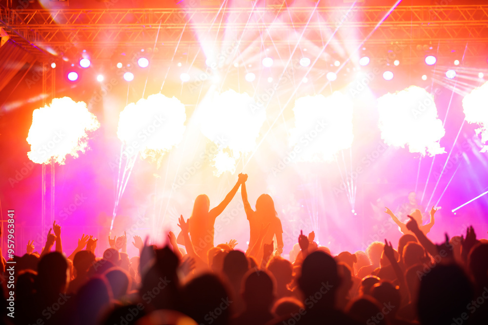 Wall mural Crowd at concert and colorful stage lights.