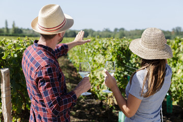 portrait of couple working at vineyard