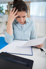 Naklejka premium a young beautiful woman stressed because of bills