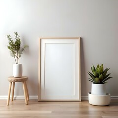 A minimalist mockup featuring a blank picture frame on a light wood floor. framed by greenery and a stool.