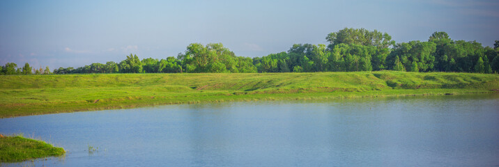village pond in warm summer