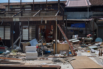 Demolition site with pillars standing amid rubble and construction debris